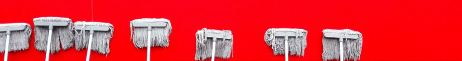 Image of a red wall being cleaned CC0